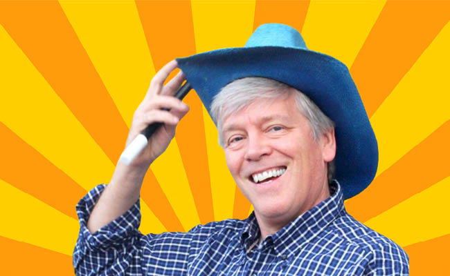 Person wearing a blue cowboy hat, smiling against a bright, radial yellow and orange background.