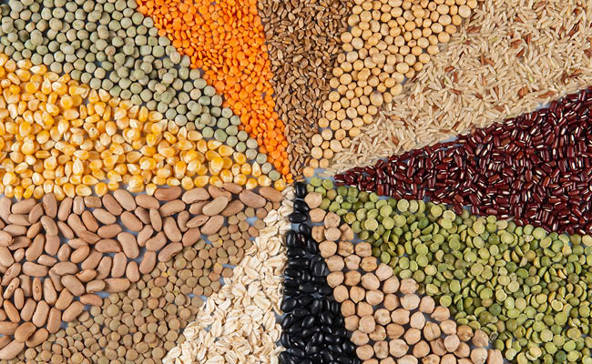 Big collection of different cereals and edible seeds. Grain angular pattern with top view