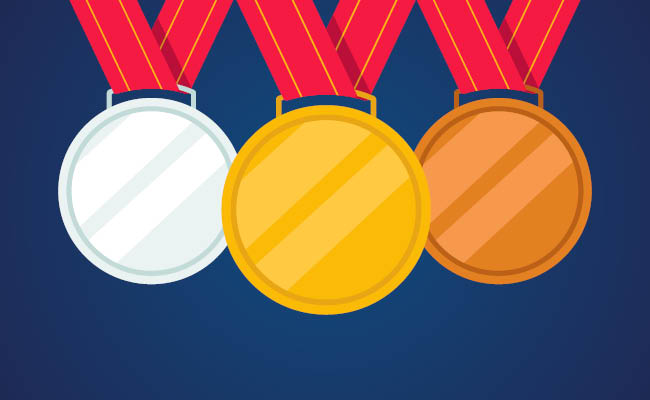 Gold silver and bronze medals with red ribbons on a dark blue background